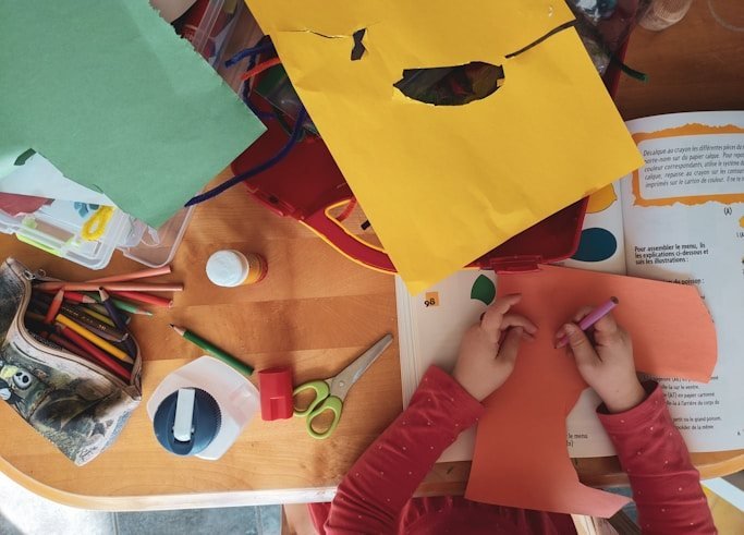 Children doing arts and crafts at a table