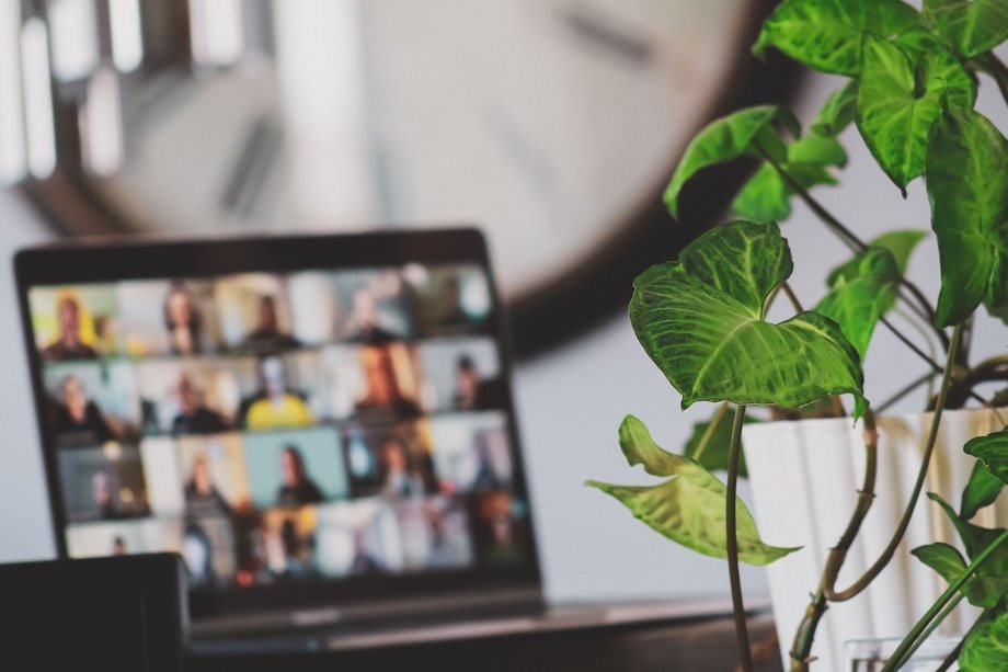 A laptop showing an online video meeting